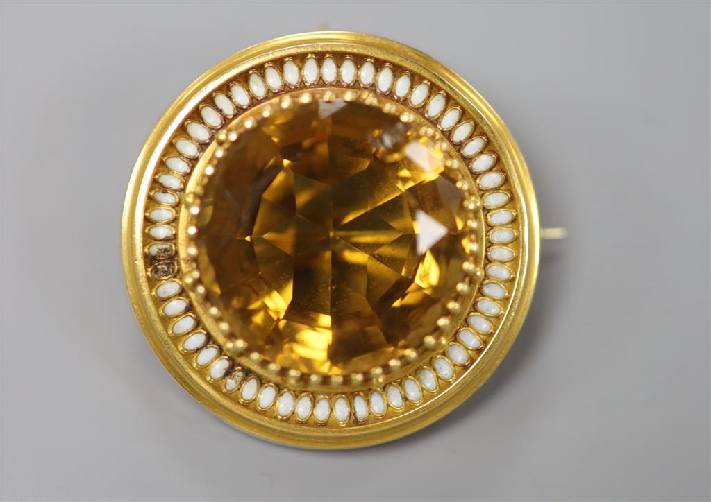A Victorian yellow metal, citrine(chipped) and white enamel set target pendant brooch, 37mm, gross 16.6 grams (enamel a.f.).